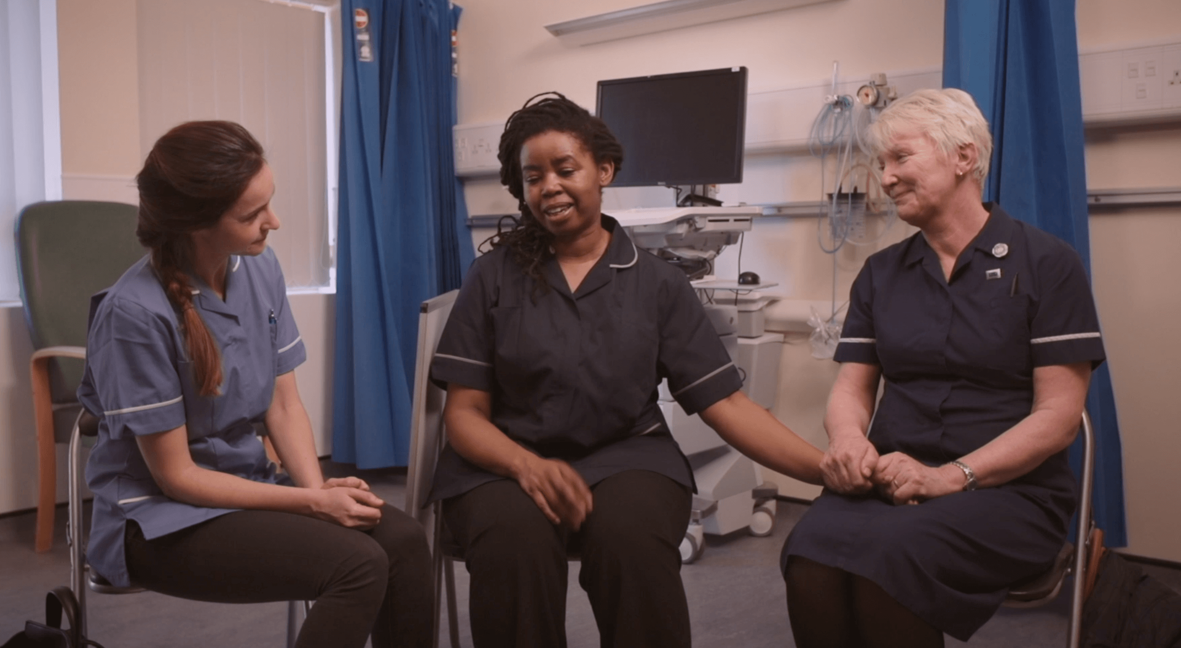 Three nurses sitting together from film No Yeah Buts